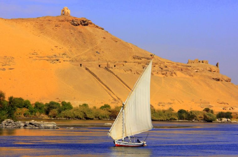 aswan guide points to a felucca ride