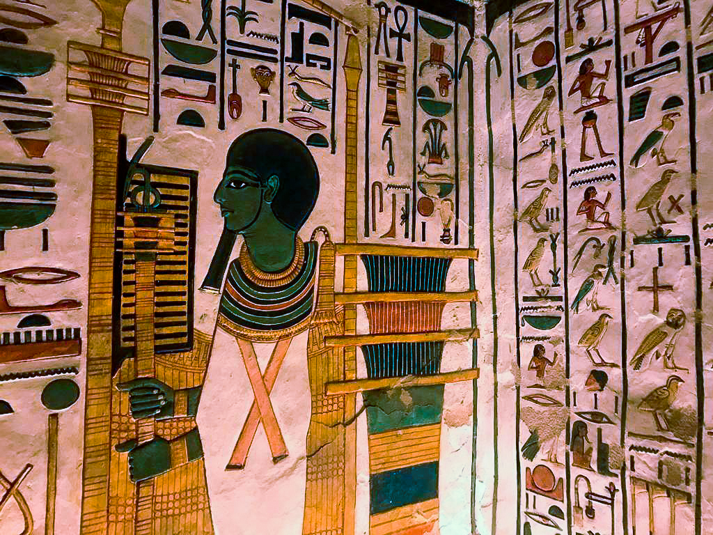 Frescoes inside the tomb of Nefertari - one guard is pacing back and forth.