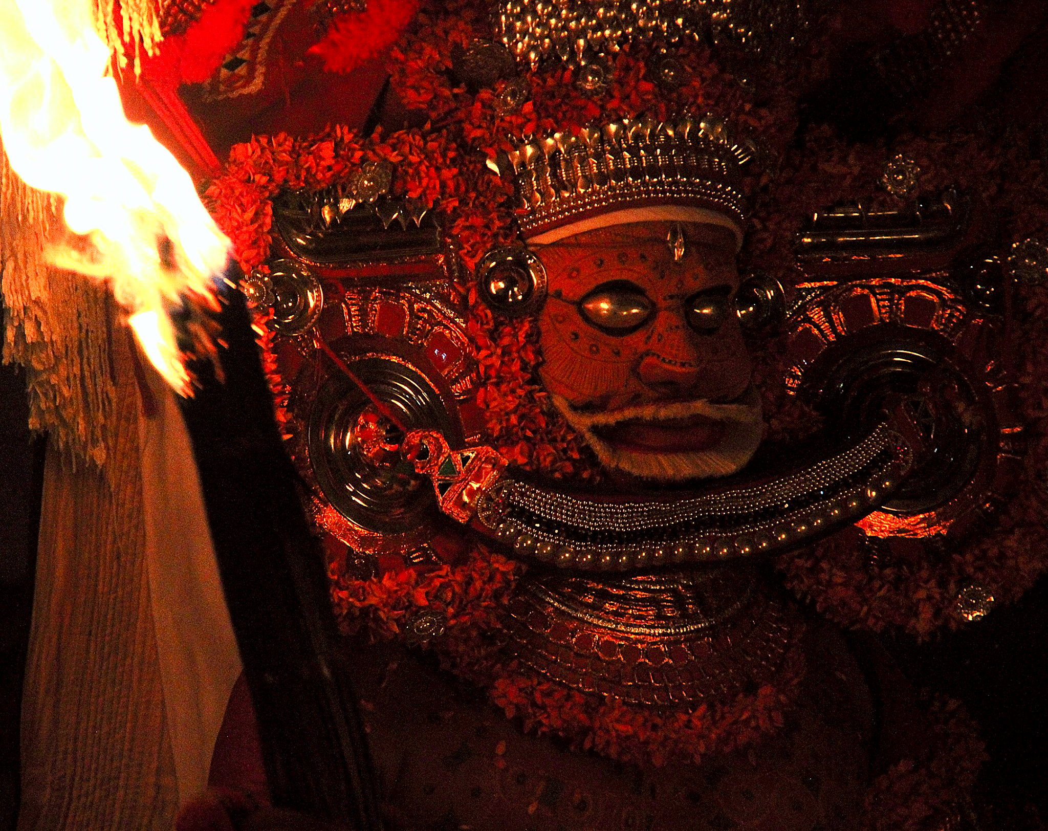 The deity theyyam performer